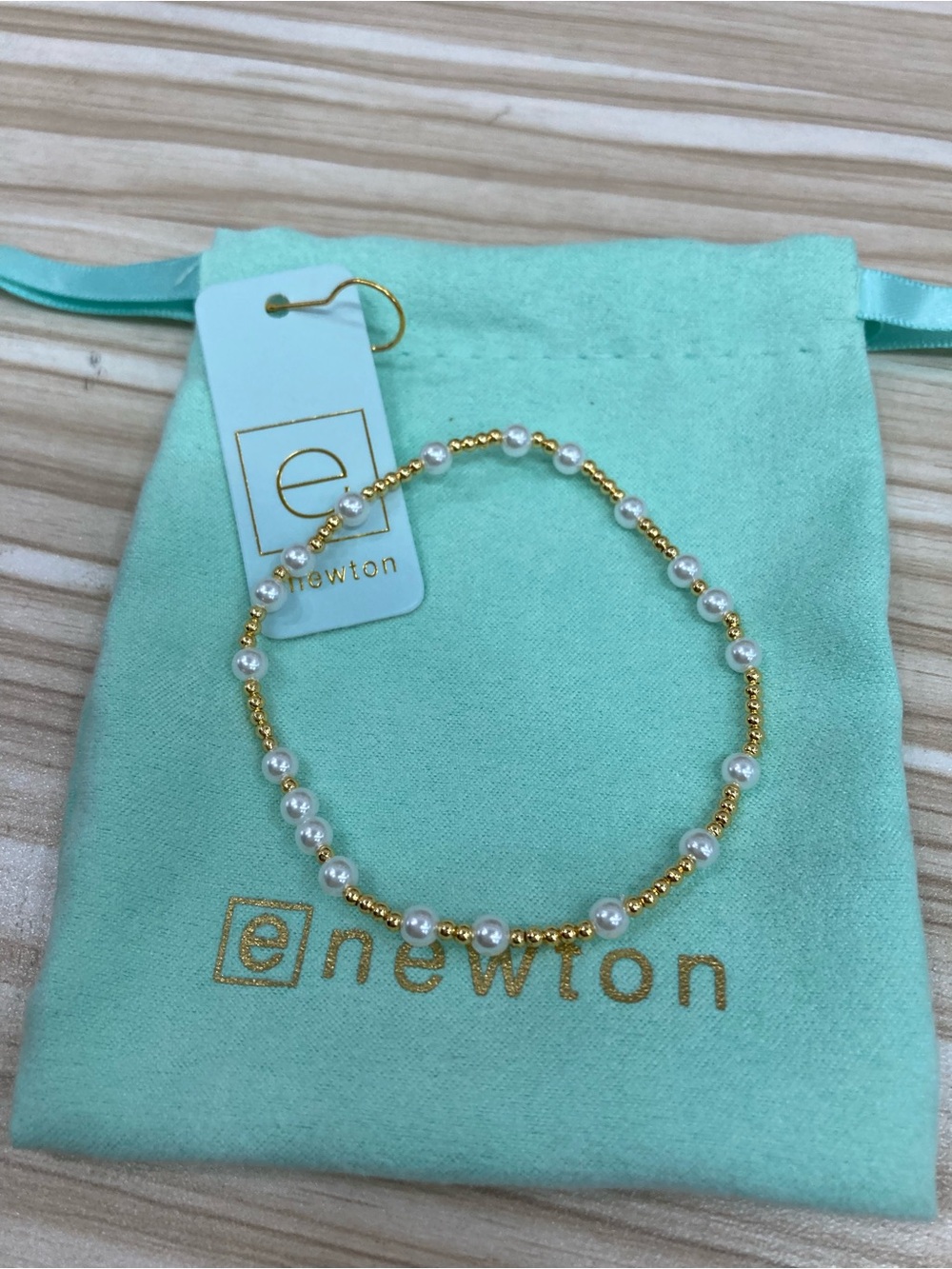 Newton Gold and White Pearl Stretch Bracelet on Mint Pouch